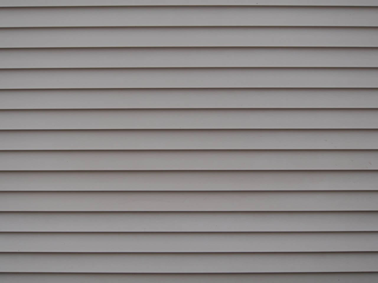 gray composite cladding on the exterior of a house