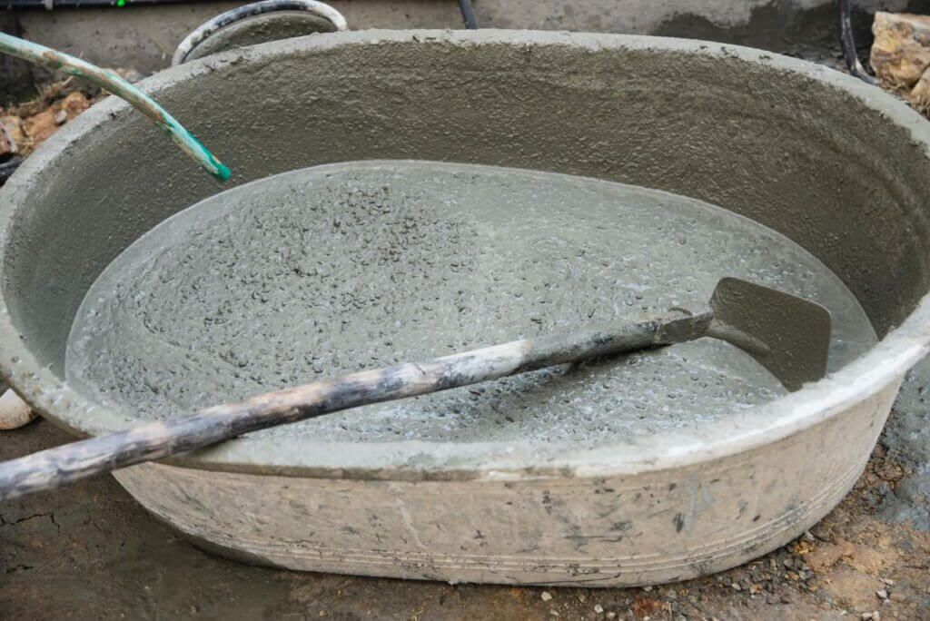 cement mix in a large plastic container
